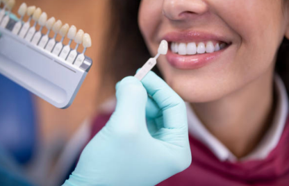 A woman receiving dental treatment, showcasing her enhanced smile after dental veneer treatment