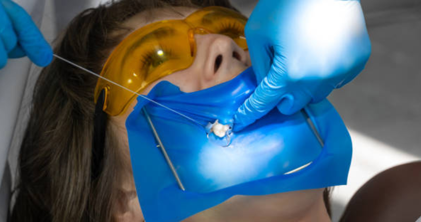 An example of a female patient receiving oral and maxillofacial surgery and wearing a blue mask