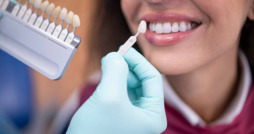 A woman receiving dental treatment, showcasing her enhanced smile after dental veneer treatment